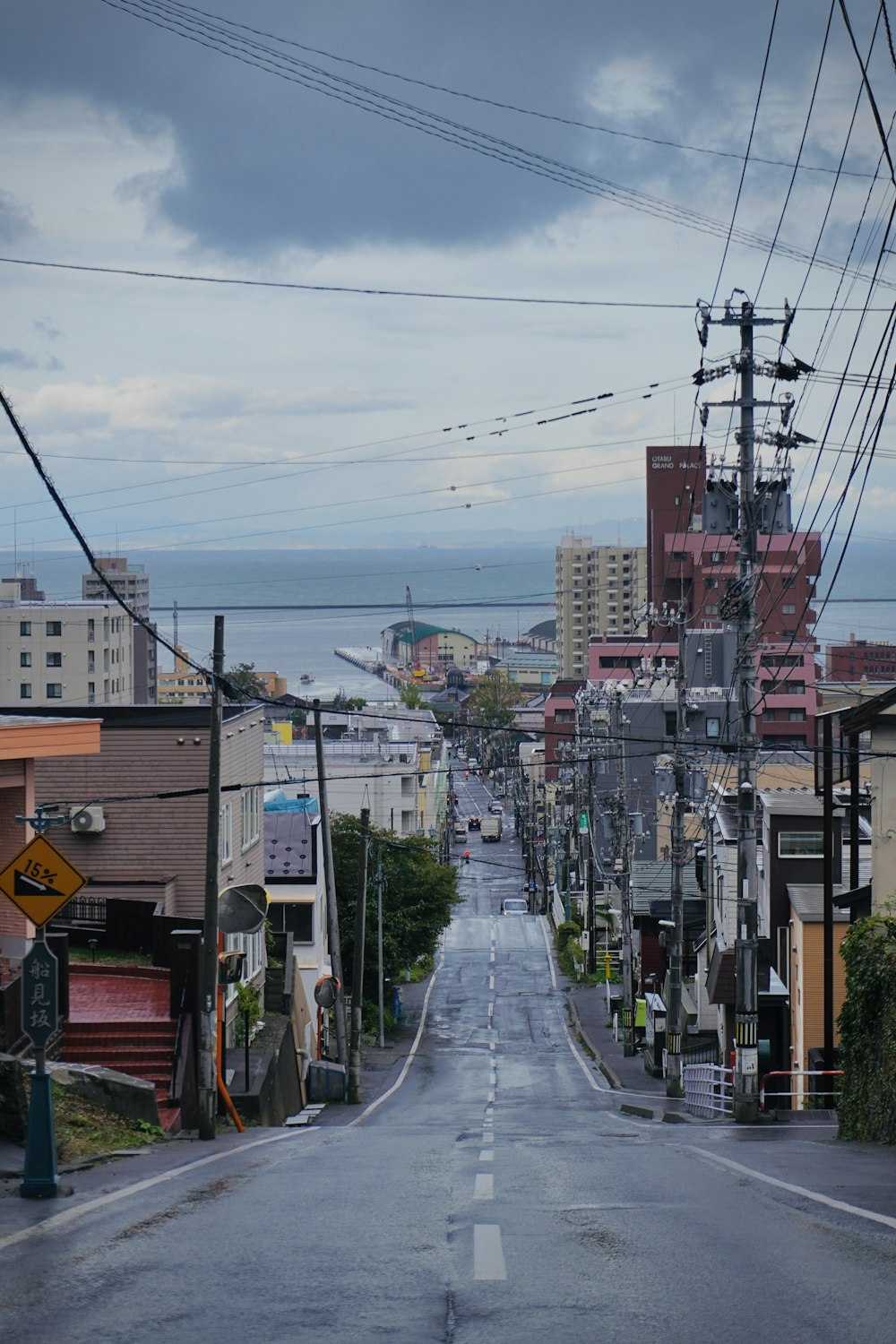 an empty street with power lines above it