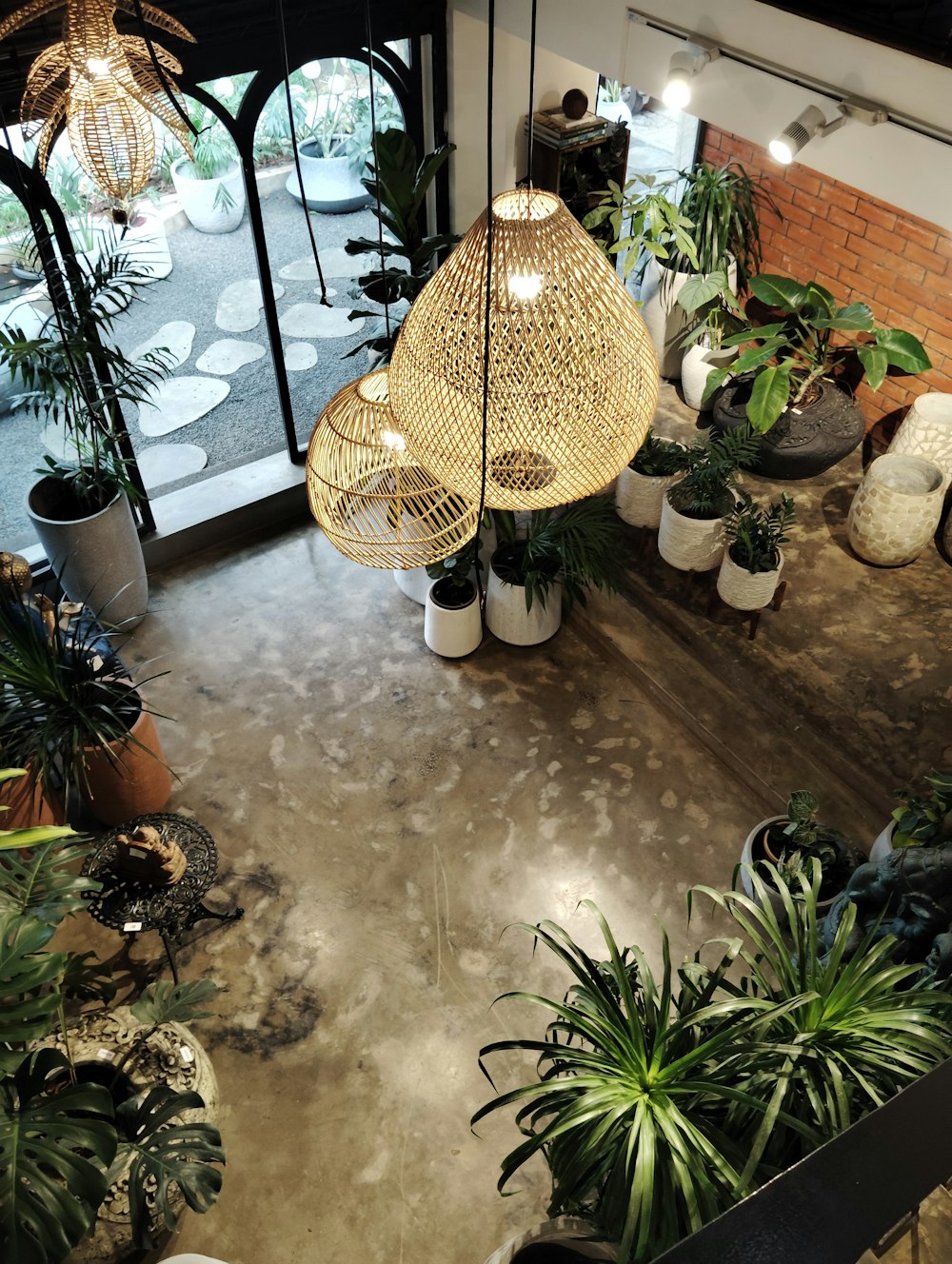 a room filled with lots of potted plants