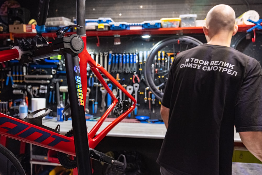 a man working on a bike in a bike shop