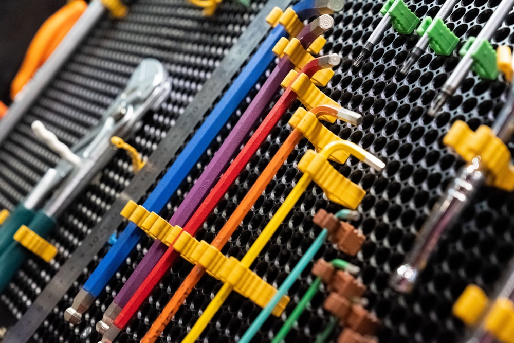 a row of colorful toothbrushes sitting on top of each other