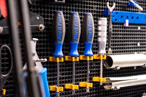 A sturdy 3D printed tool holder mounted on a workshop wall