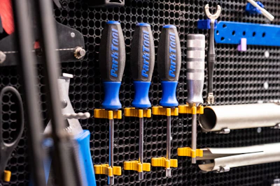 Durable plastic tool holders mounted on a garage wall