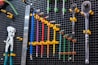 a bunch of tools are hanging on a wall
