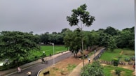 Cyclists riding along the Turia Gardens, surrounded by lush greenery.