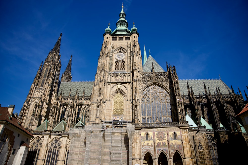 a very tall cathedral with a clock on it's side