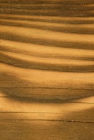Close-up of a smooth wooden deck surface highlighting natural grain and texture.
