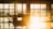 A bright and clean office environment with sunlight streaming through large windows.