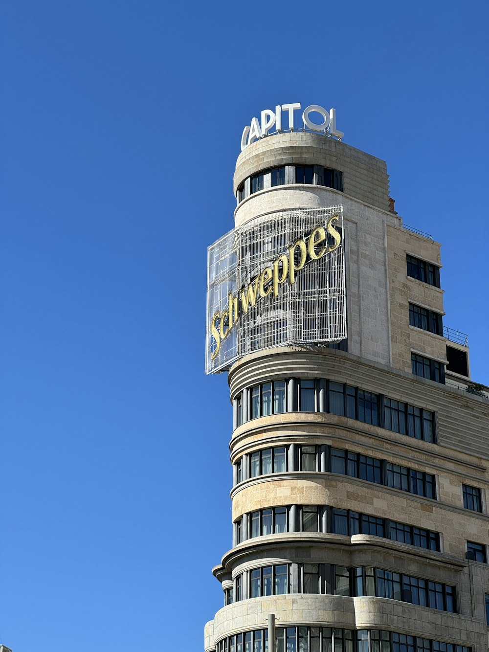 a tall building with a sign on top of it