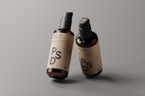 Sophisticated branding mockup featuring the budrum.com logo on sleek bottles.