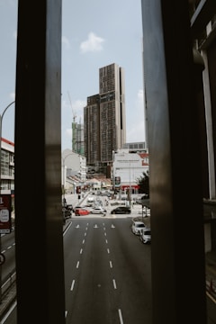a view of a city street through a window