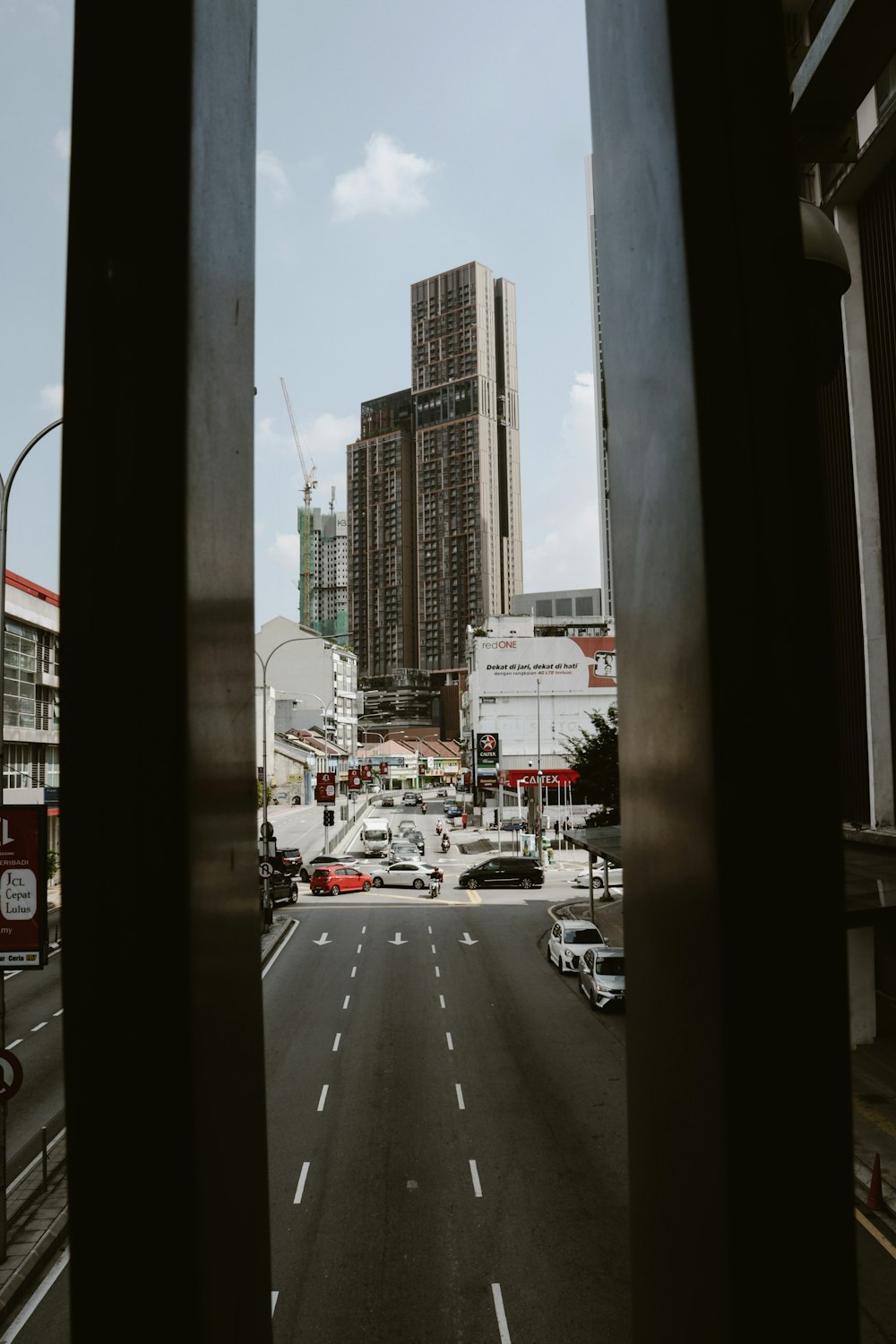 a view of a city street through a window