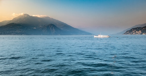 A day boat cruising gently on Lake Erie under a clear sky near Norfolk County.