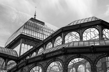 a black and white photo of a building with many windows