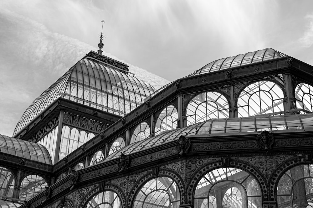 a black and white photo of a building with many windows