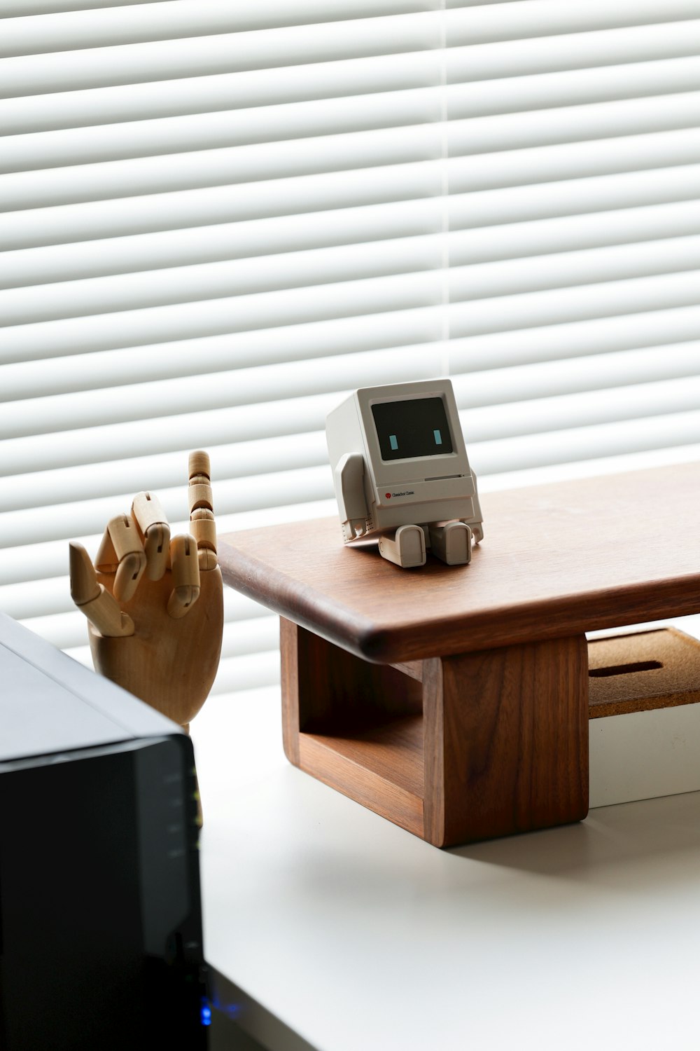 a wooden table with a computer on top of it
