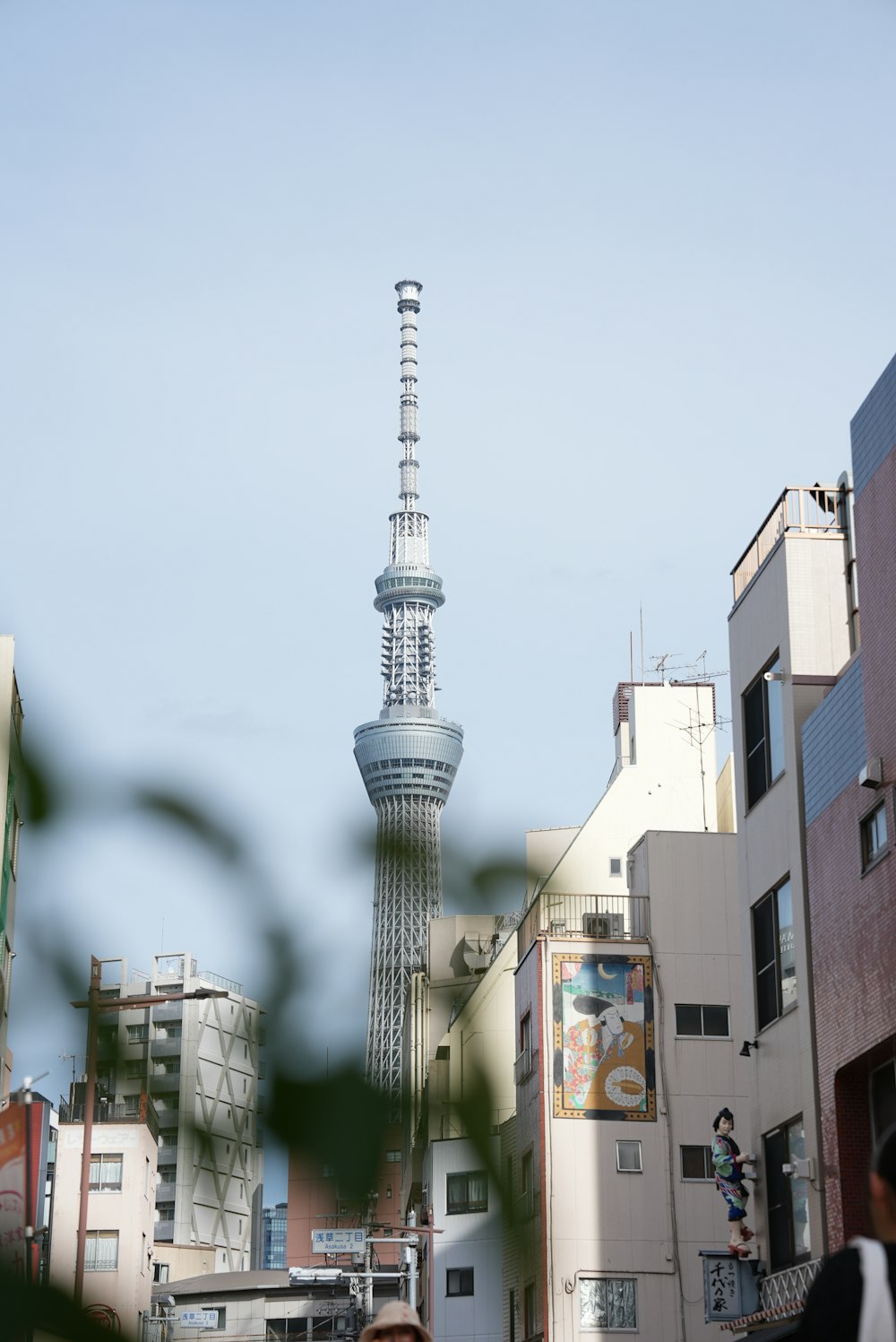 a woman standing in front of a tall building