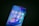 A smartphone displays a variety of popular app icons on its screen, including YouTube, Google Play Store, Chrome, Google Maps, Facebook, Messenger, Business Suite, Instagram, WhatsApp, Pinterest, Discord, and TikTok. The screen has a vibrant background with blue and purple hues.