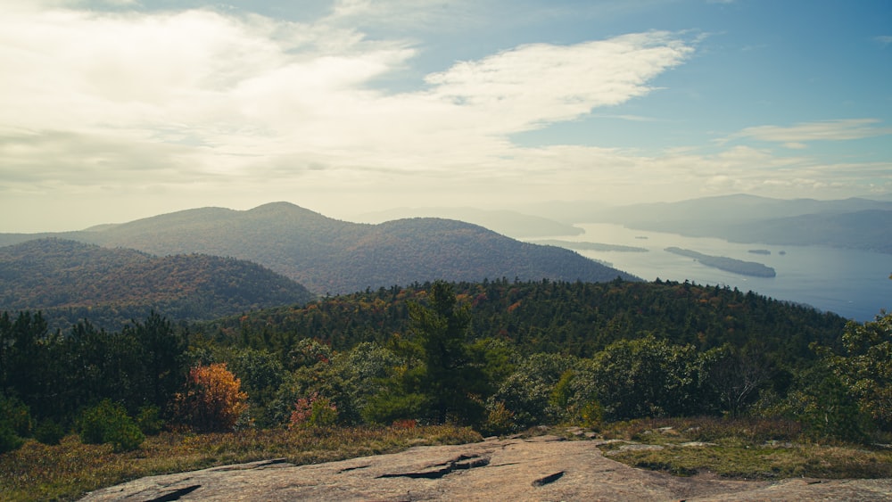 a view of a mountain range with a lake in the distance