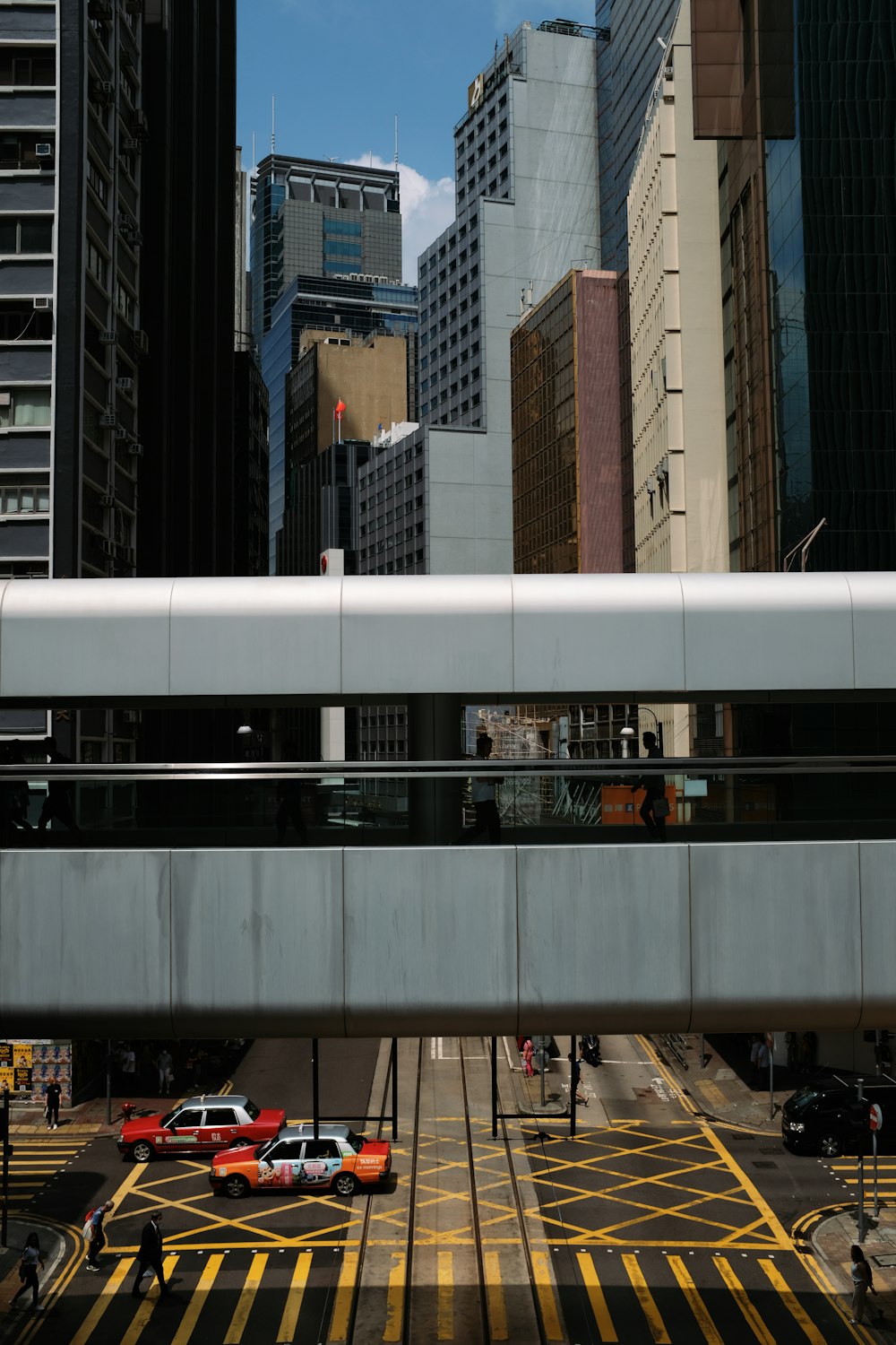 a train traveling through a city next to tall buildings