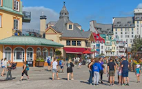 A vibrant street scene from a small village in Europe, with locals smiling warmly.