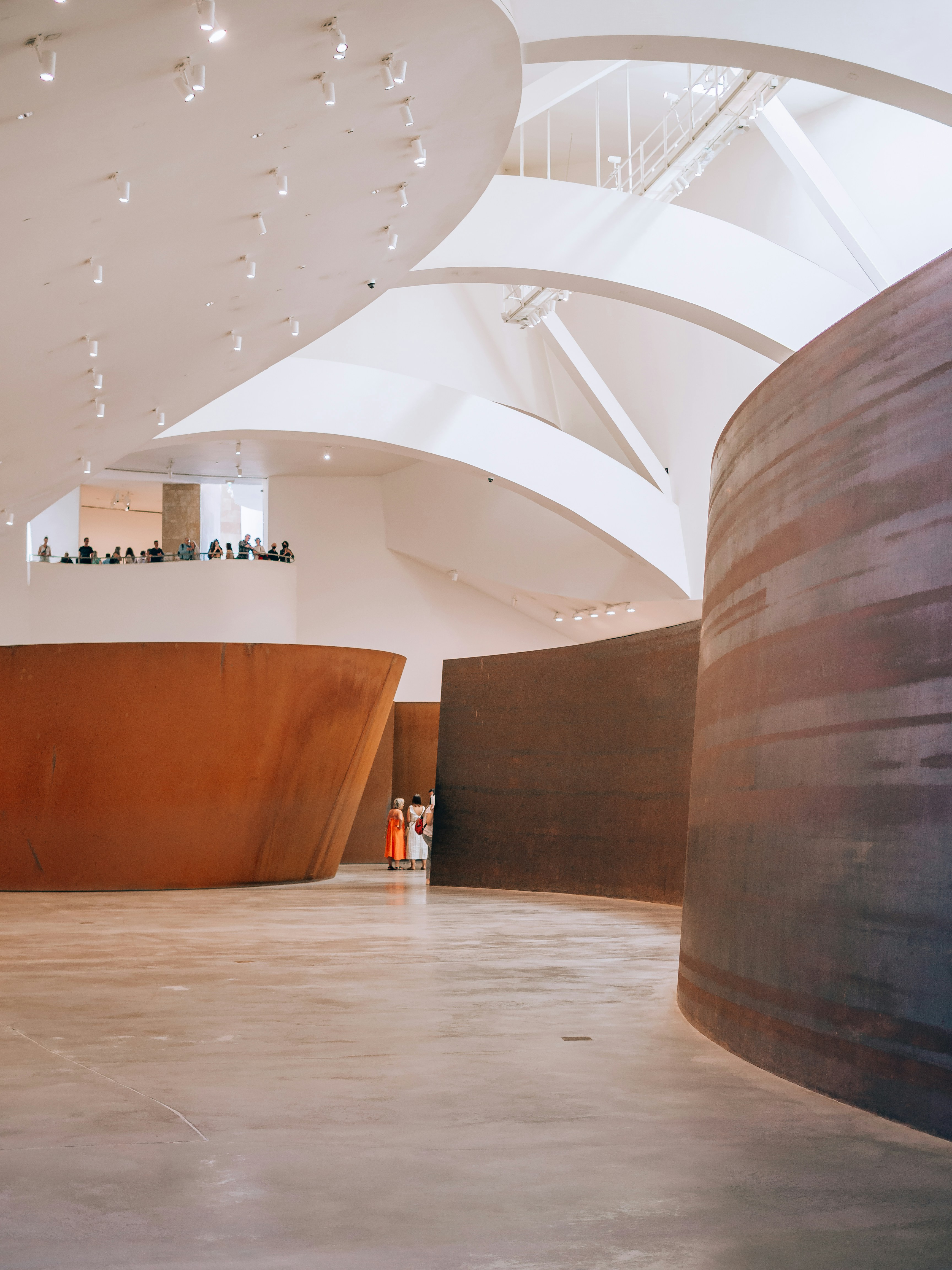 a group of people standing inside of a building