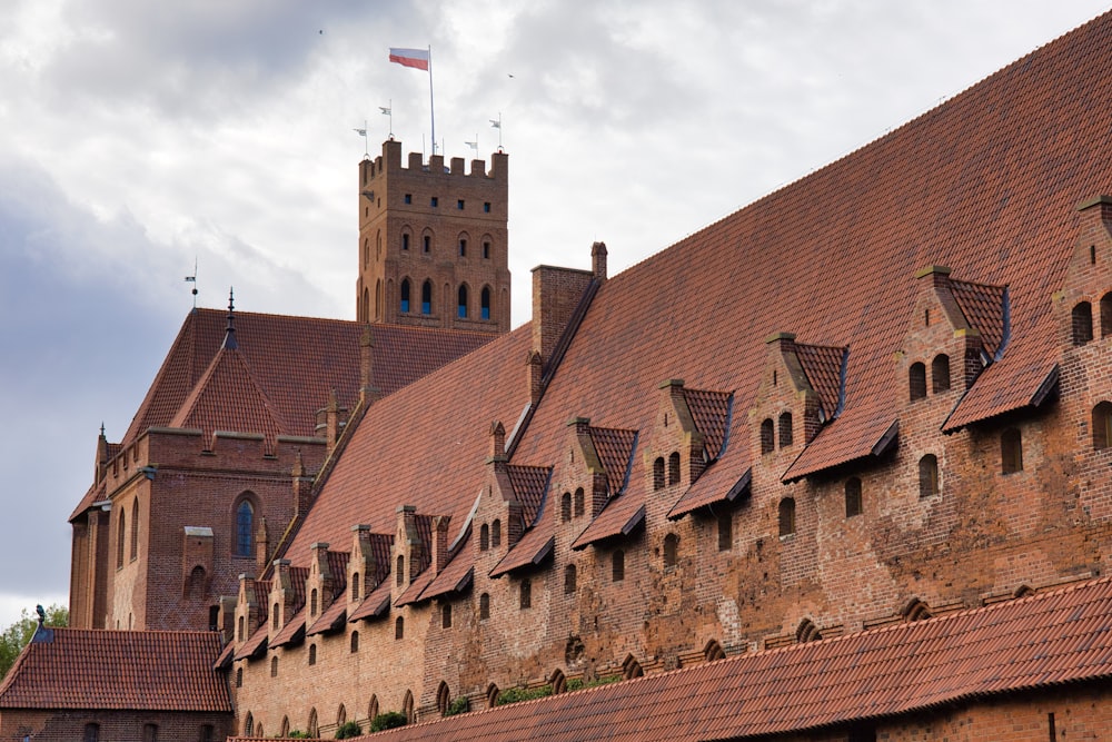 a large building with a clock tower in the background