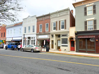 Street view showing multiple commercial properties lined up with clear signage.