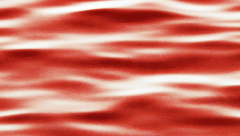 a red and white photo of water