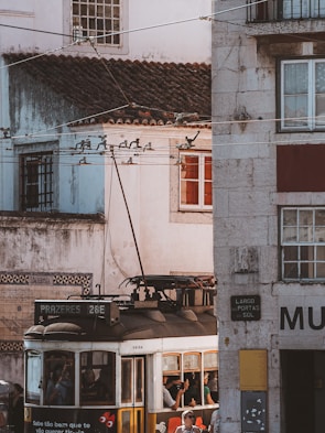 Colorful trams winding through the narrow streets of Lisbon’s historic district.