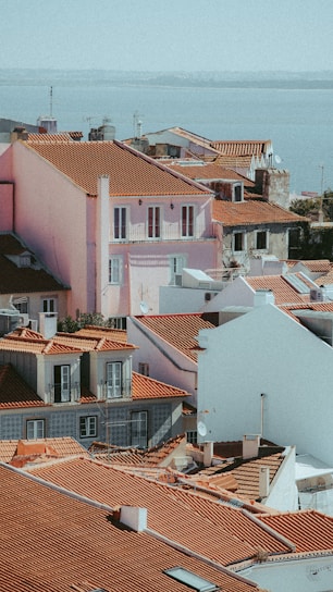 A scenic view of a coastal town with vibrant buildings and a clear blue sky.