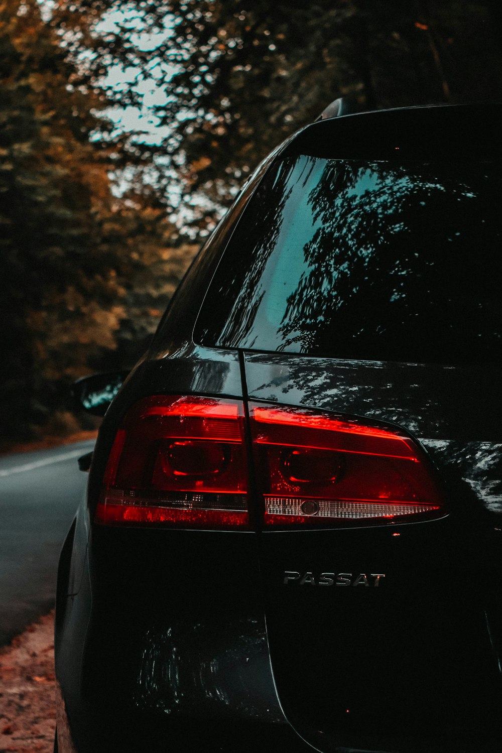 a black car parked on the side of the road