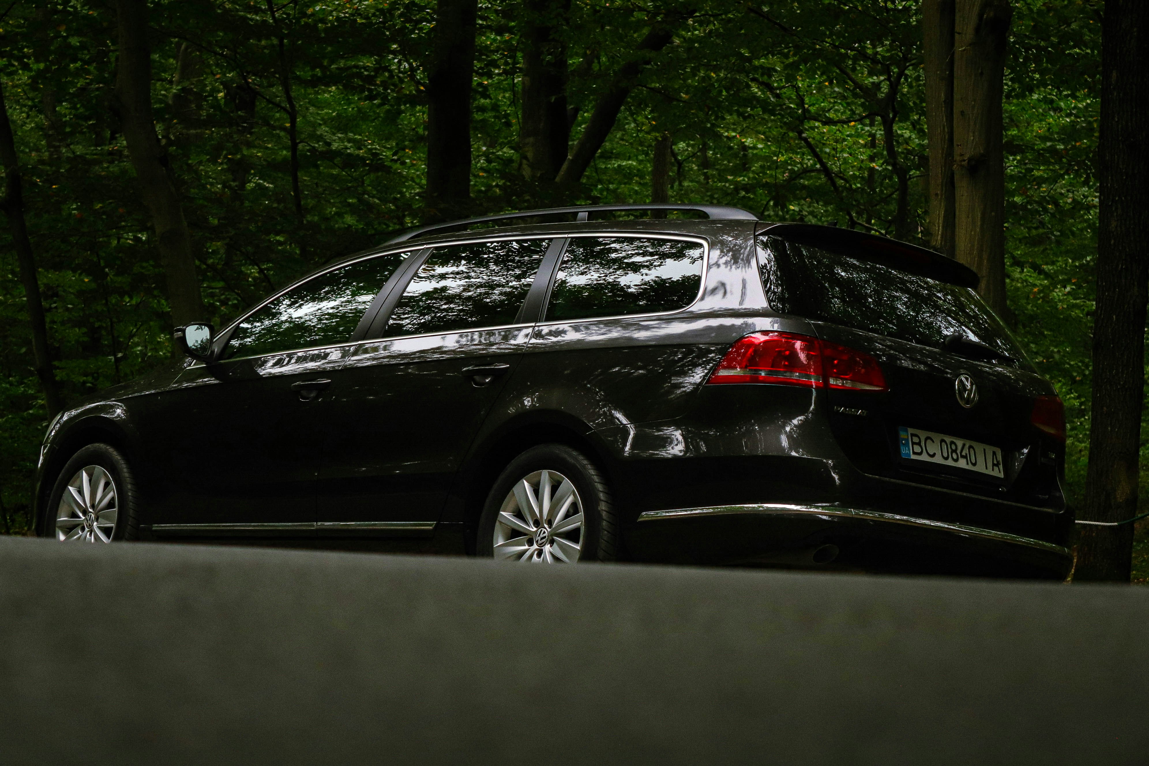a black car parked on the side of the road