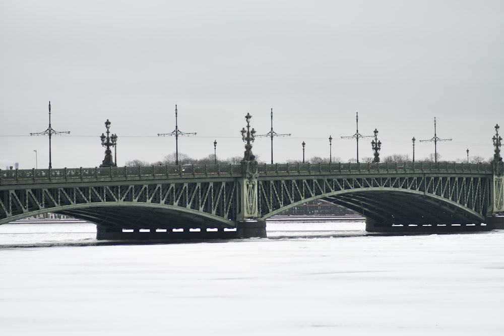 a bridge over a body of water on a cloudy day