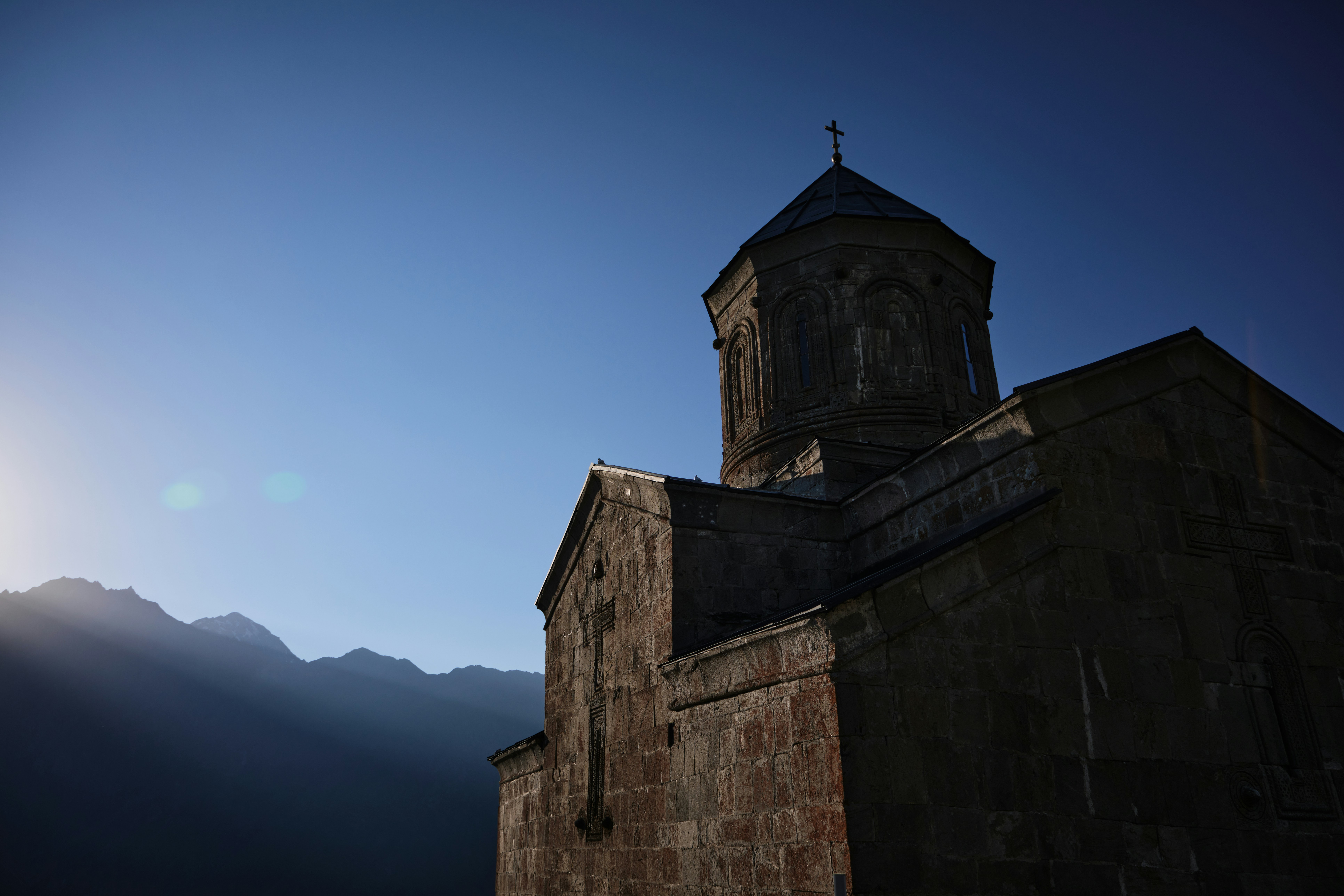a church with a steeple and a cross on top