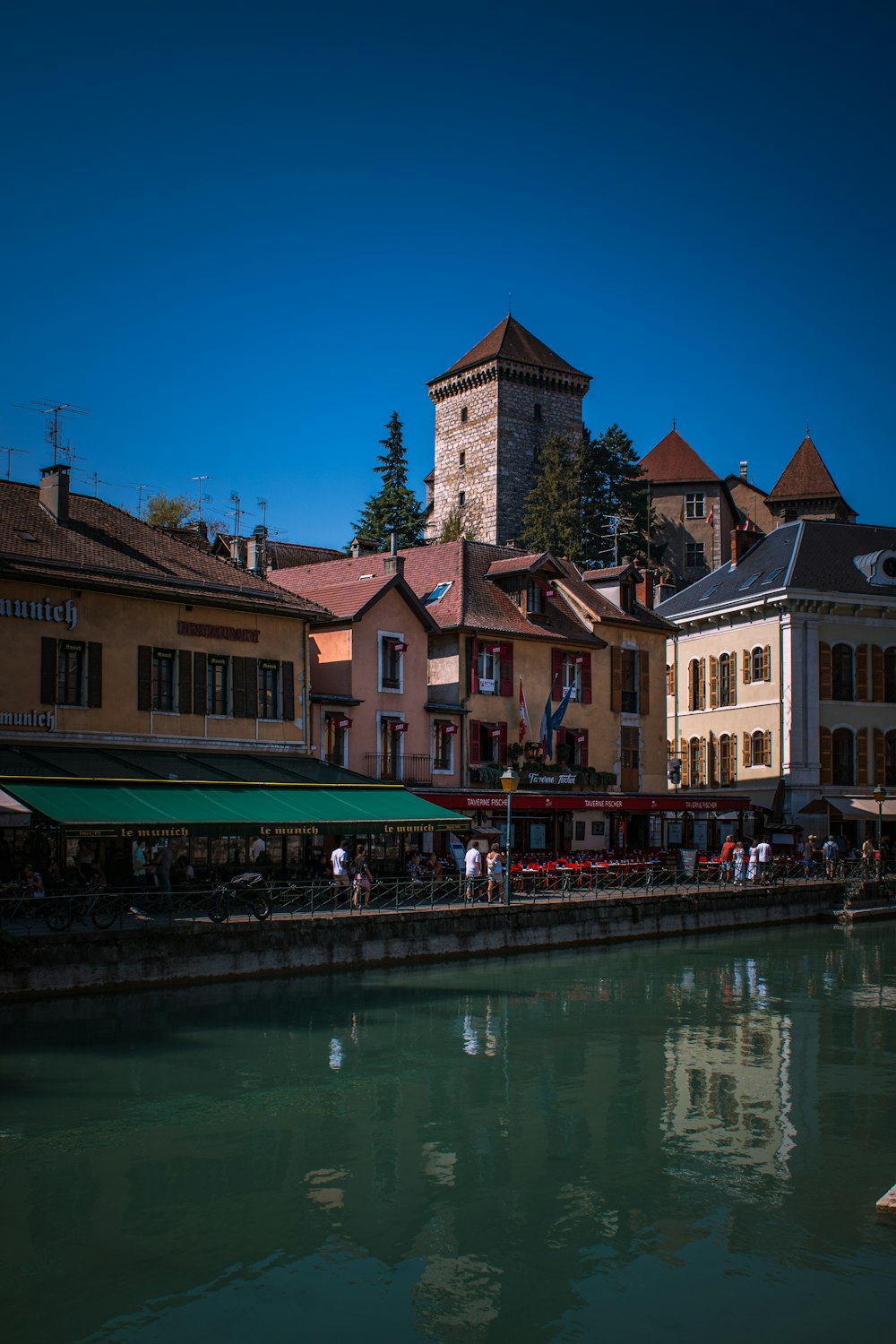 a river running through a city next to tall buildings