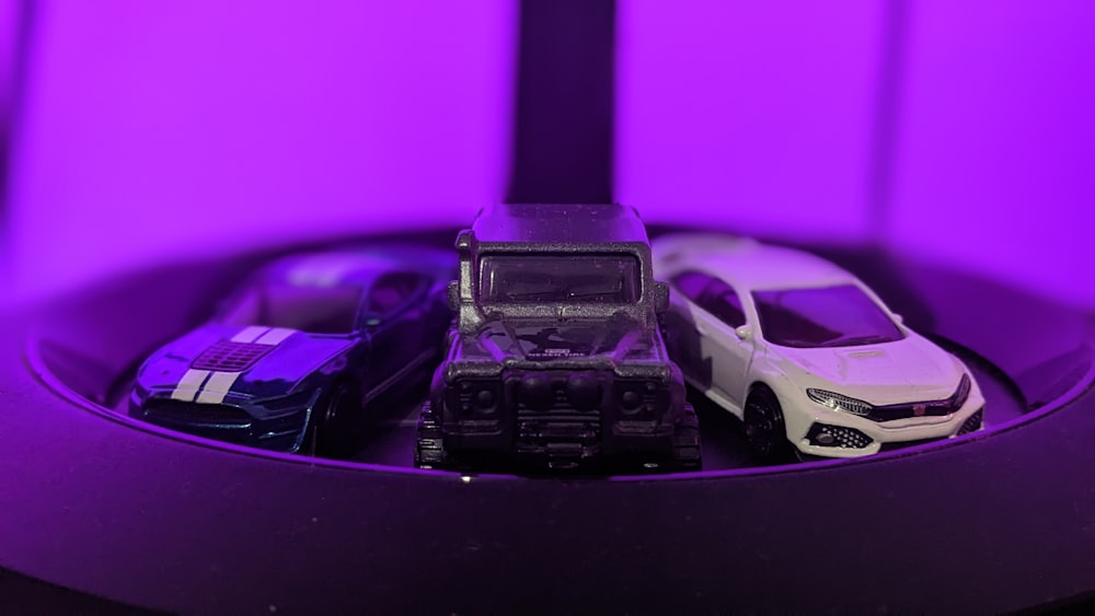 a group of toy cars sitting on top of a table