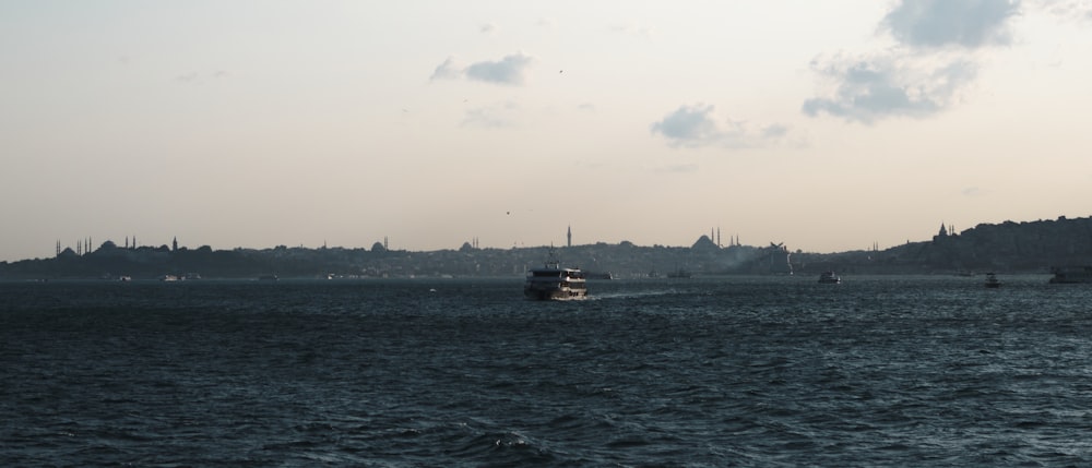 a boat traveling across a large body of water