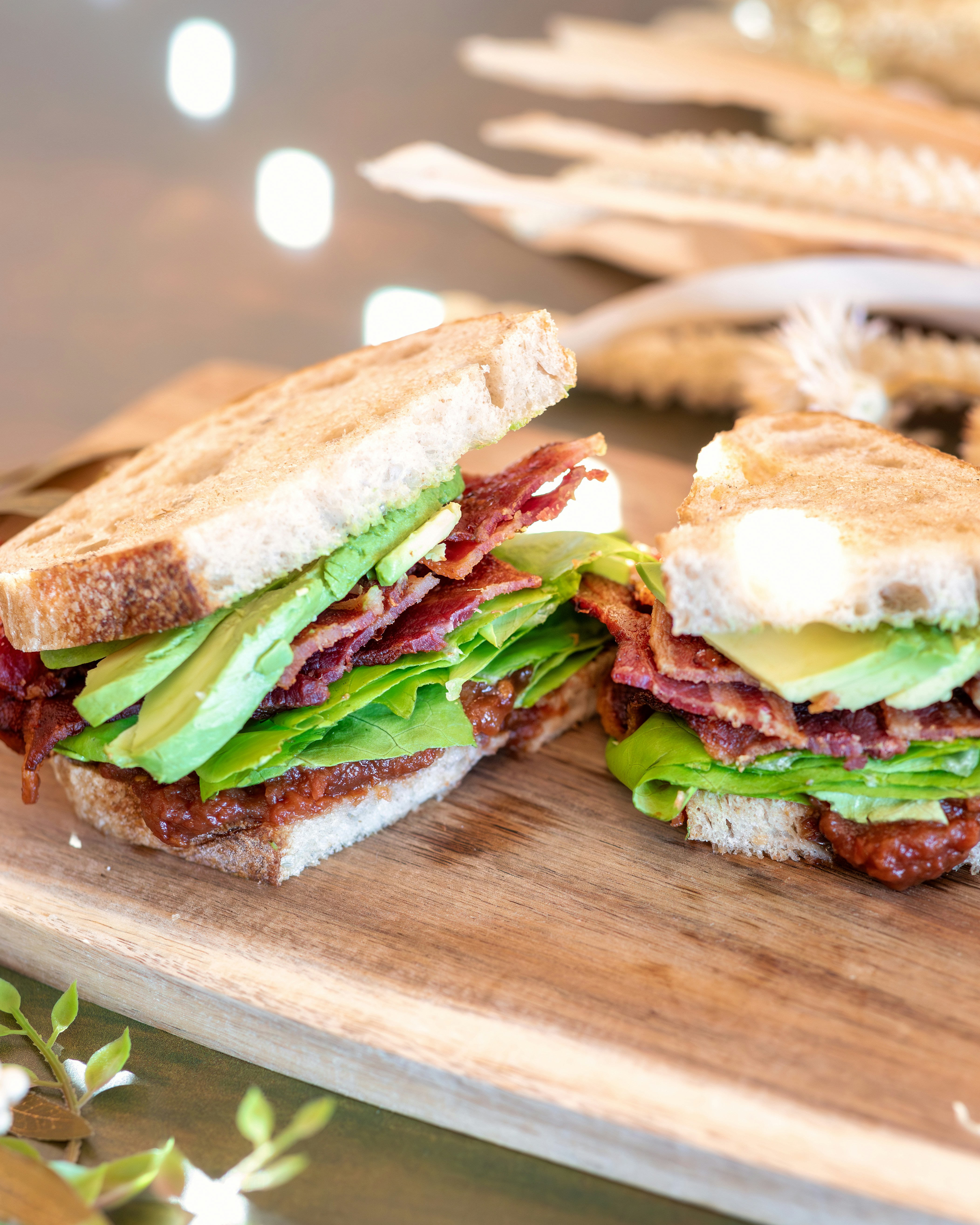Avocado halves filled with crispy bacon, chopped tomatoes, and shredded lettuce