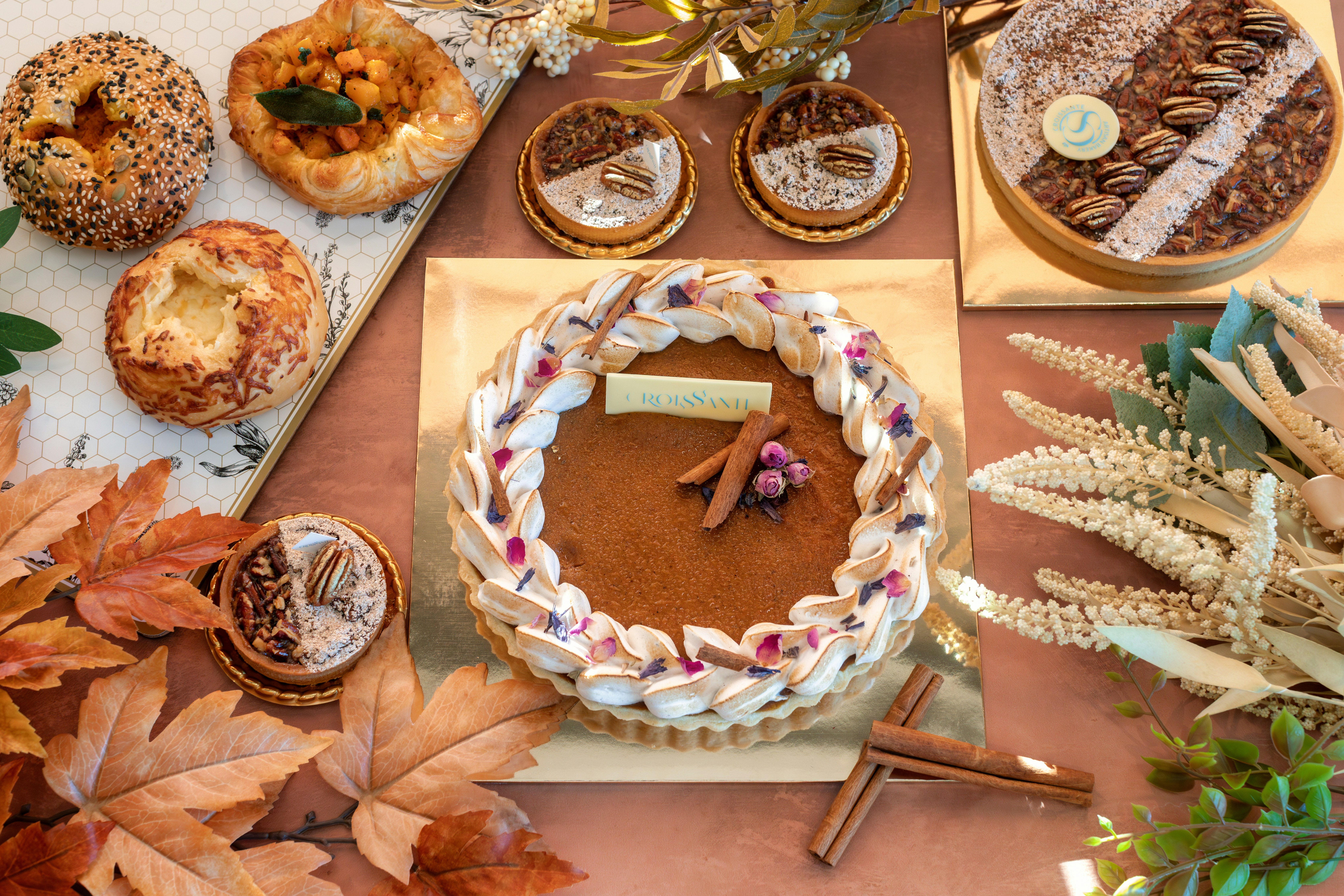 a table topped with a cake covered in frosting