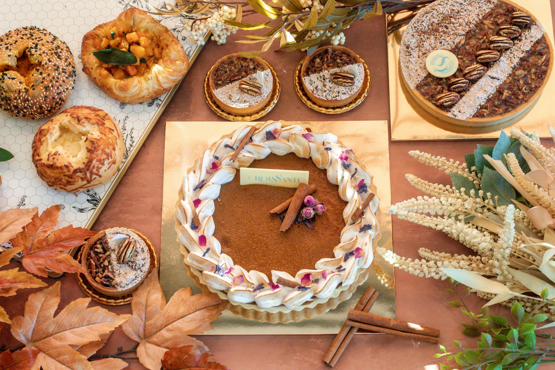 a table topped with lots of different types of pastries