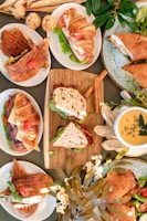 A vibrant lunch spread with salads and sandwiches.