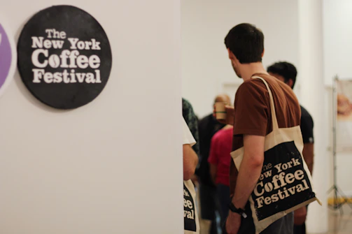 Filmmakers networking over coffee in a stylish festival lounge.