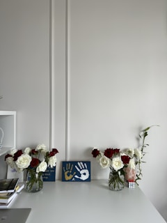 Neatly arranged cleaning supplies and fresh flowers on a tidy living room table.