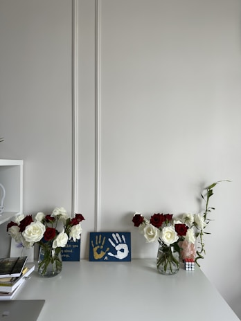 Neatly arranged cleaning supplies and fresh flowers on a tidy living room table.