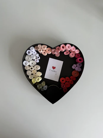 Close-up of a beautifully arranged love box featuring soft colors and thoughtful details.