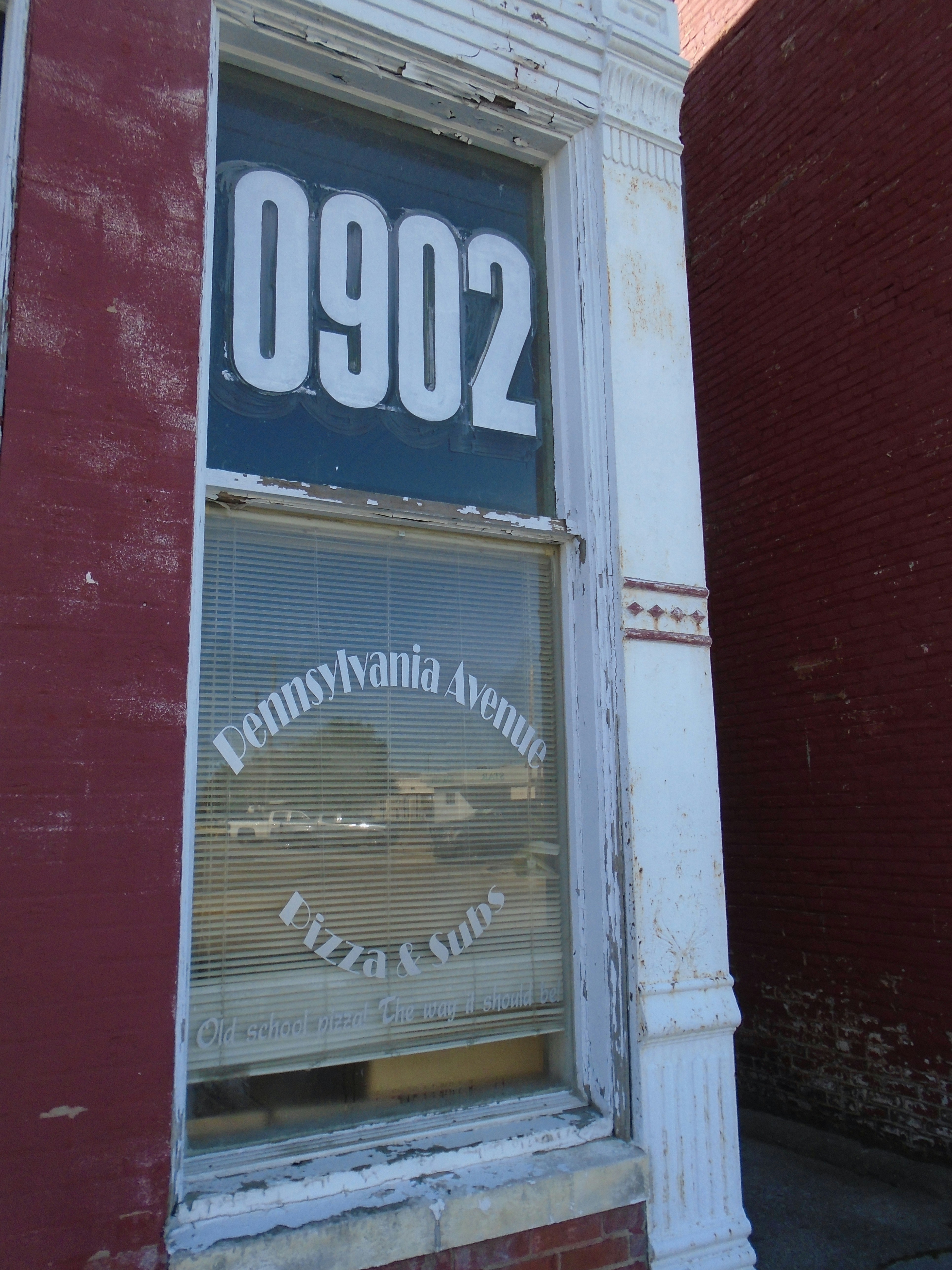 a window with a sign that says pennsylvania avenue