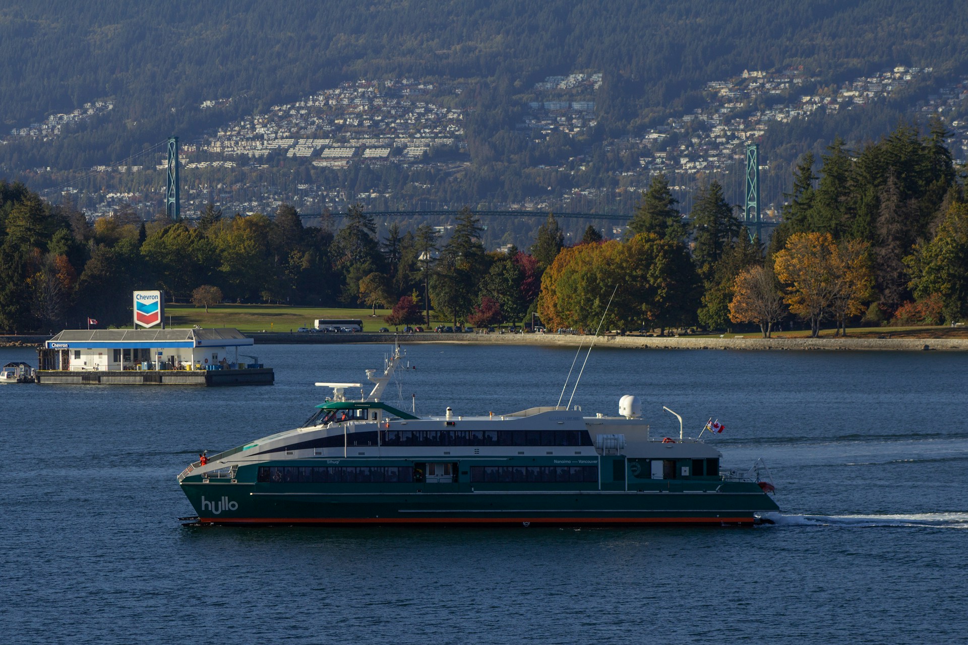 a green and red boat in a body of water