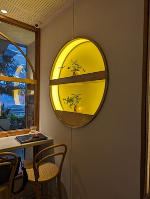 Stylish shelf decorated with plants and subtle lighting creating a welcoming atmosphere.