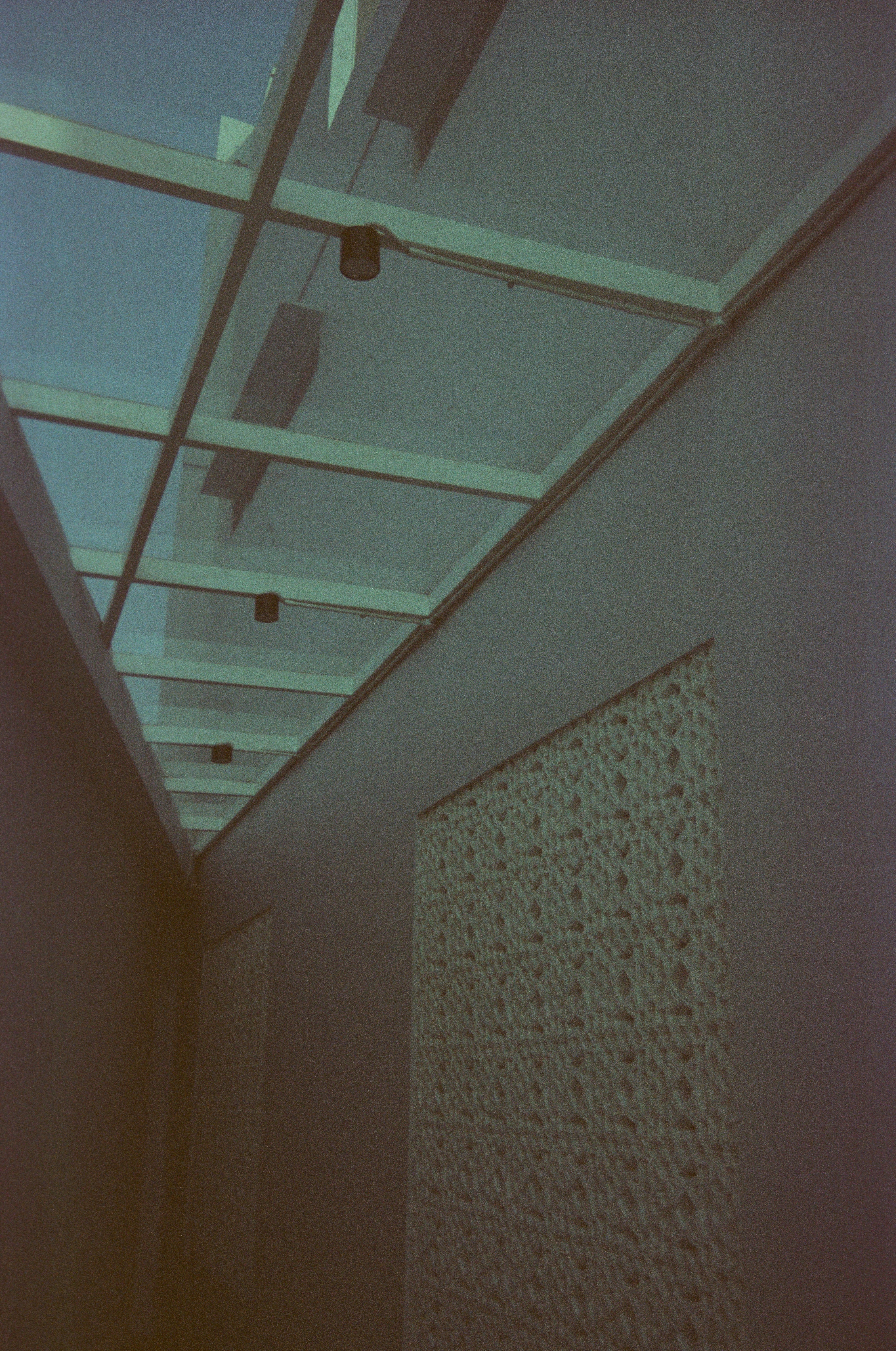 a long hallway with a skylight above it