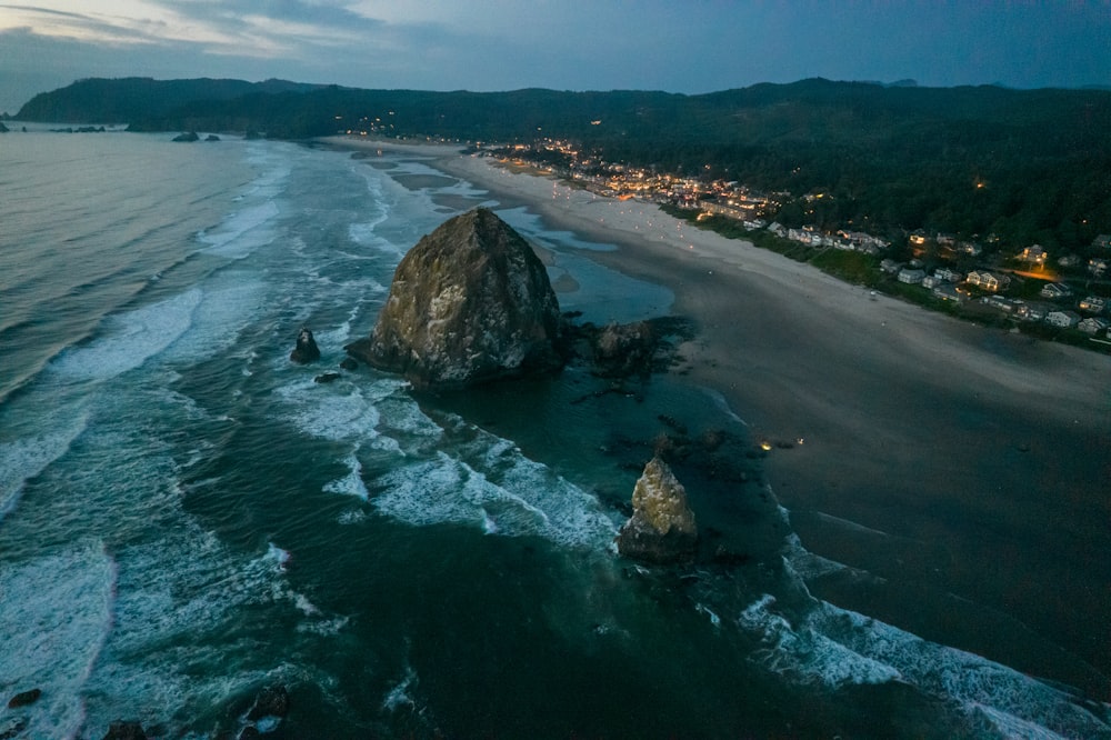 an aerial view of a beach at night